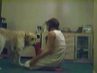 Masked girl lets her dog eat her pussy